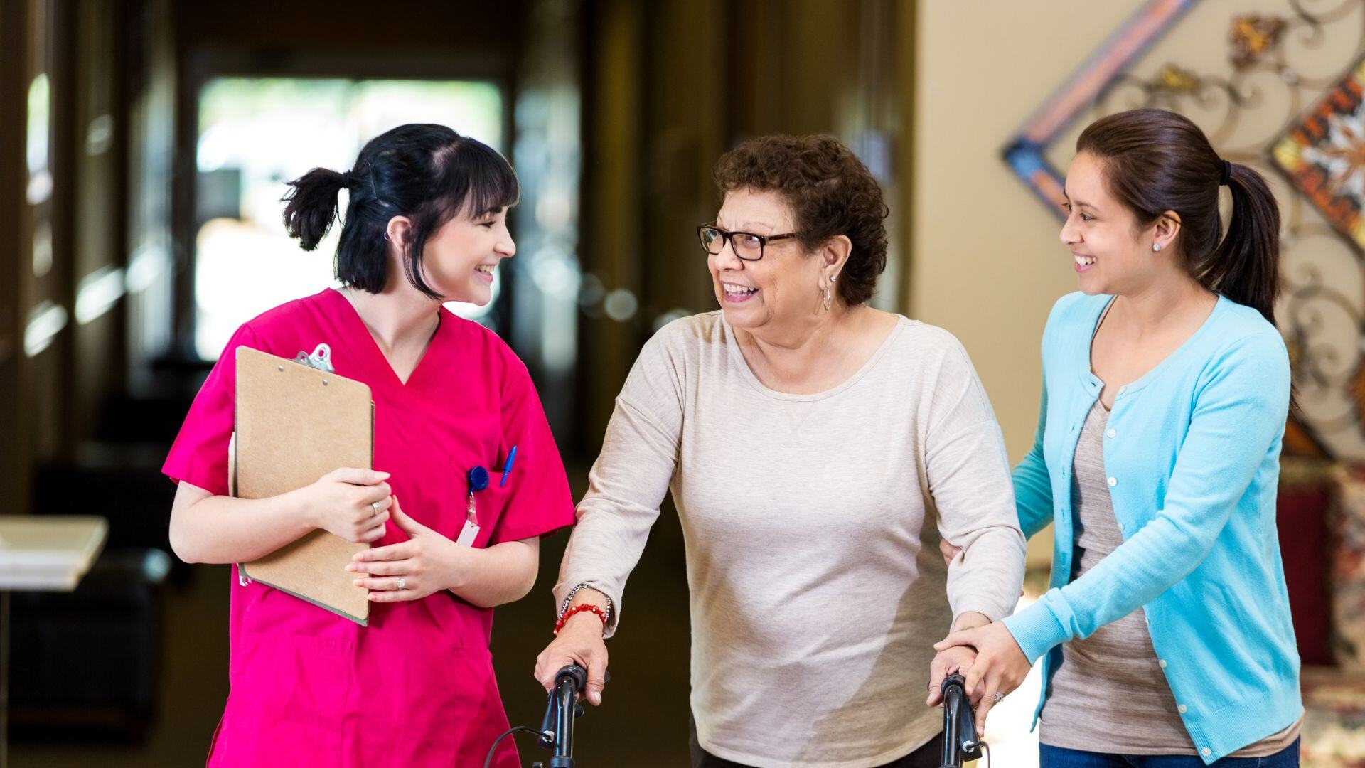 nursing staff giving a family a tour of an assisted living facilitiy